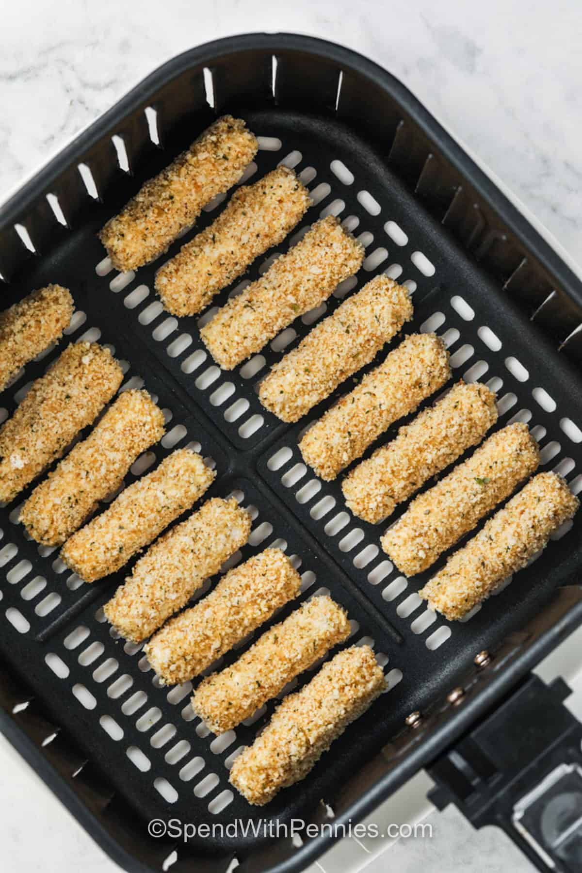 adding Air Fryer Mozzarella Sticks to air fryer