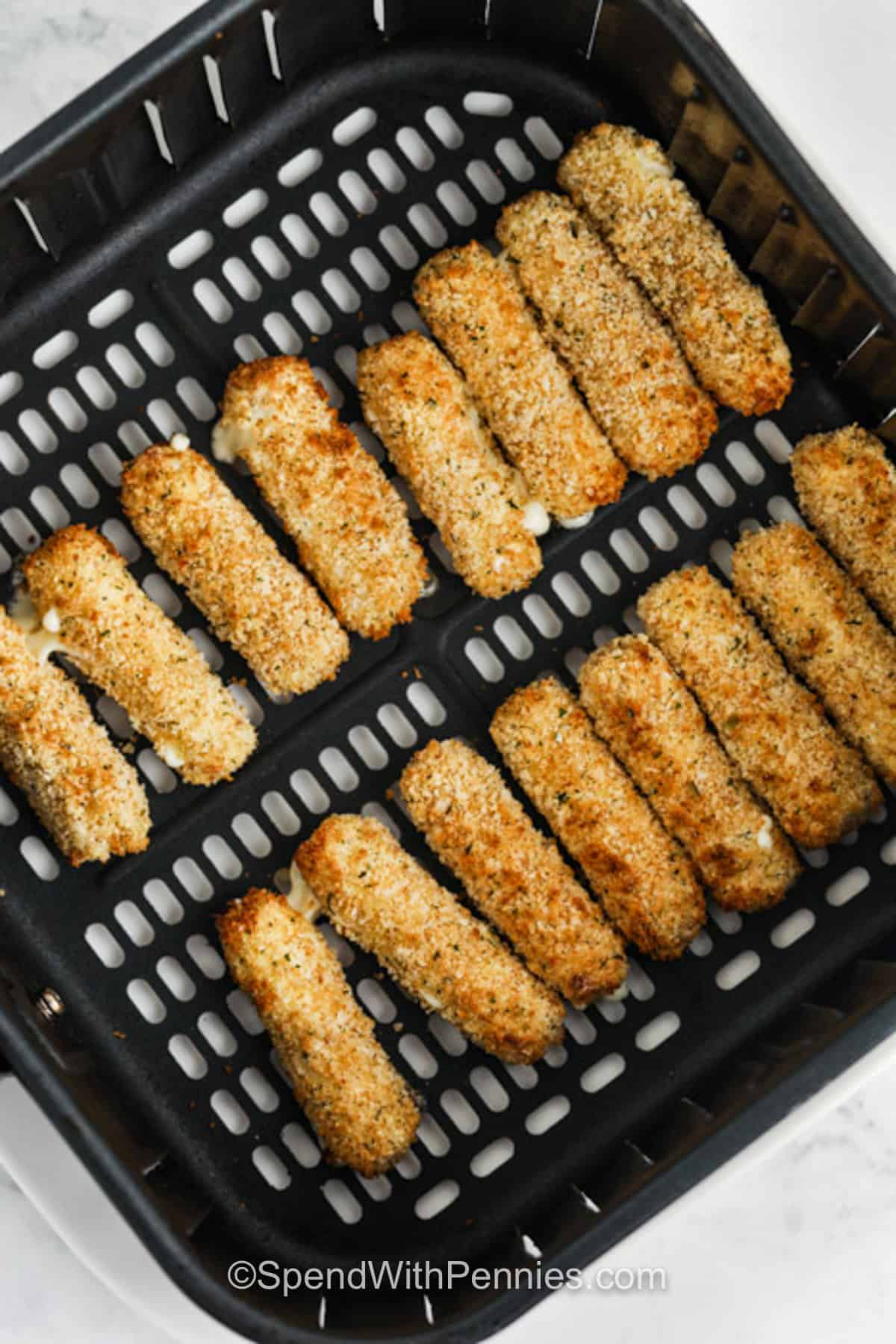 Air Fryer Mozzarella Sticks in the fryer