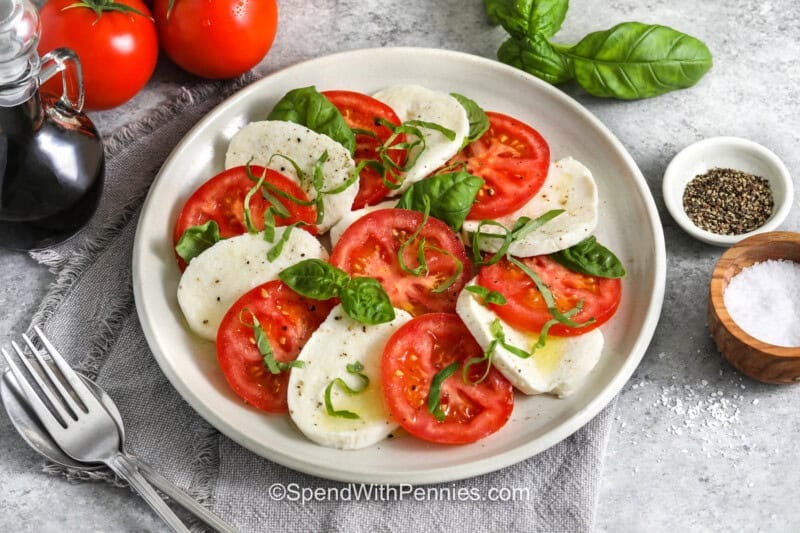 plate of Caprese Salad with basil