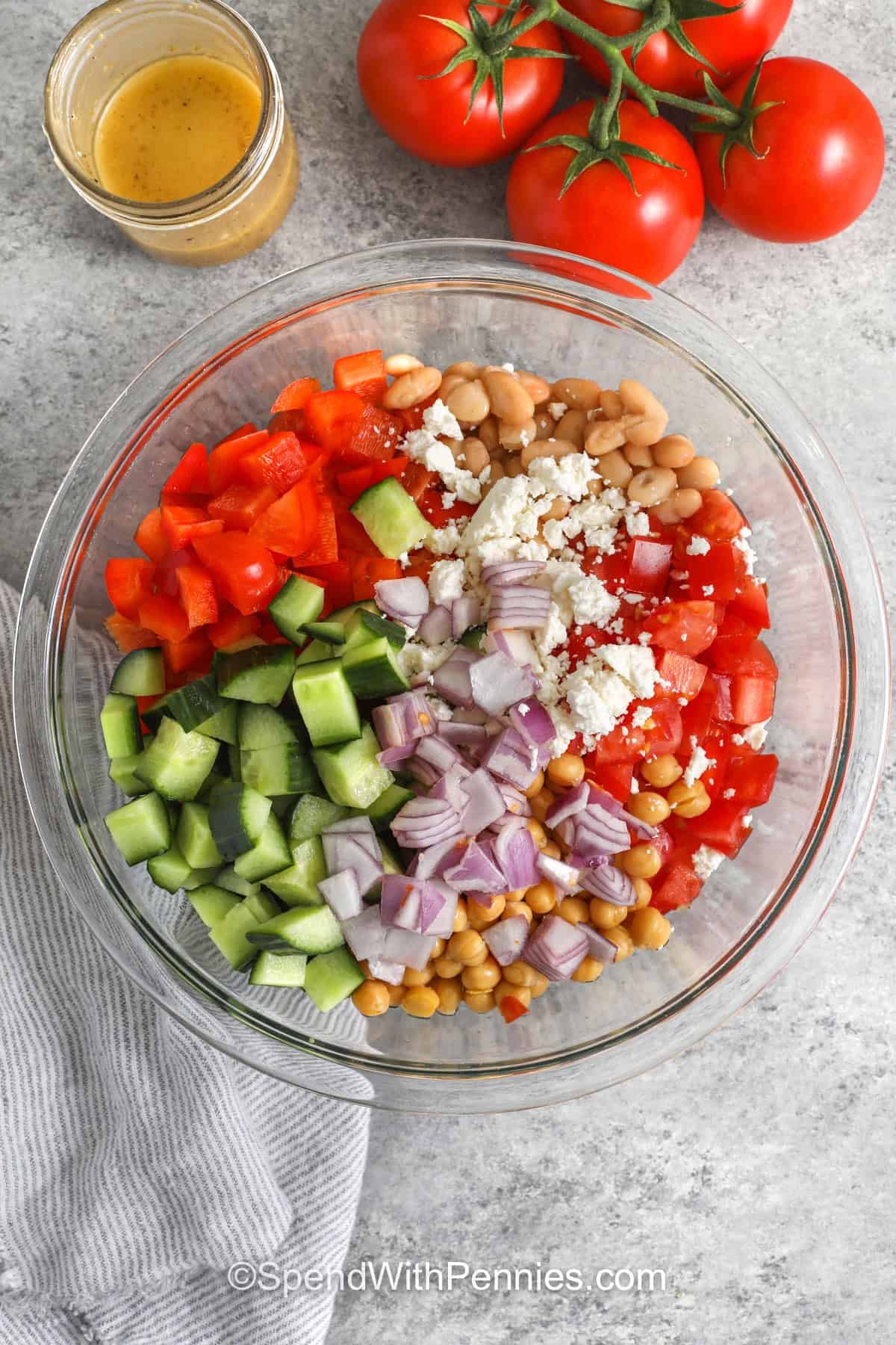 adding ingredients to bowl to make Dense Bean Salad
