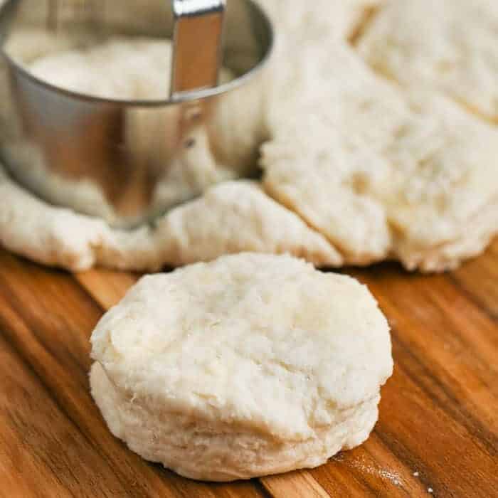 cutting dough with a cutter on a wood board