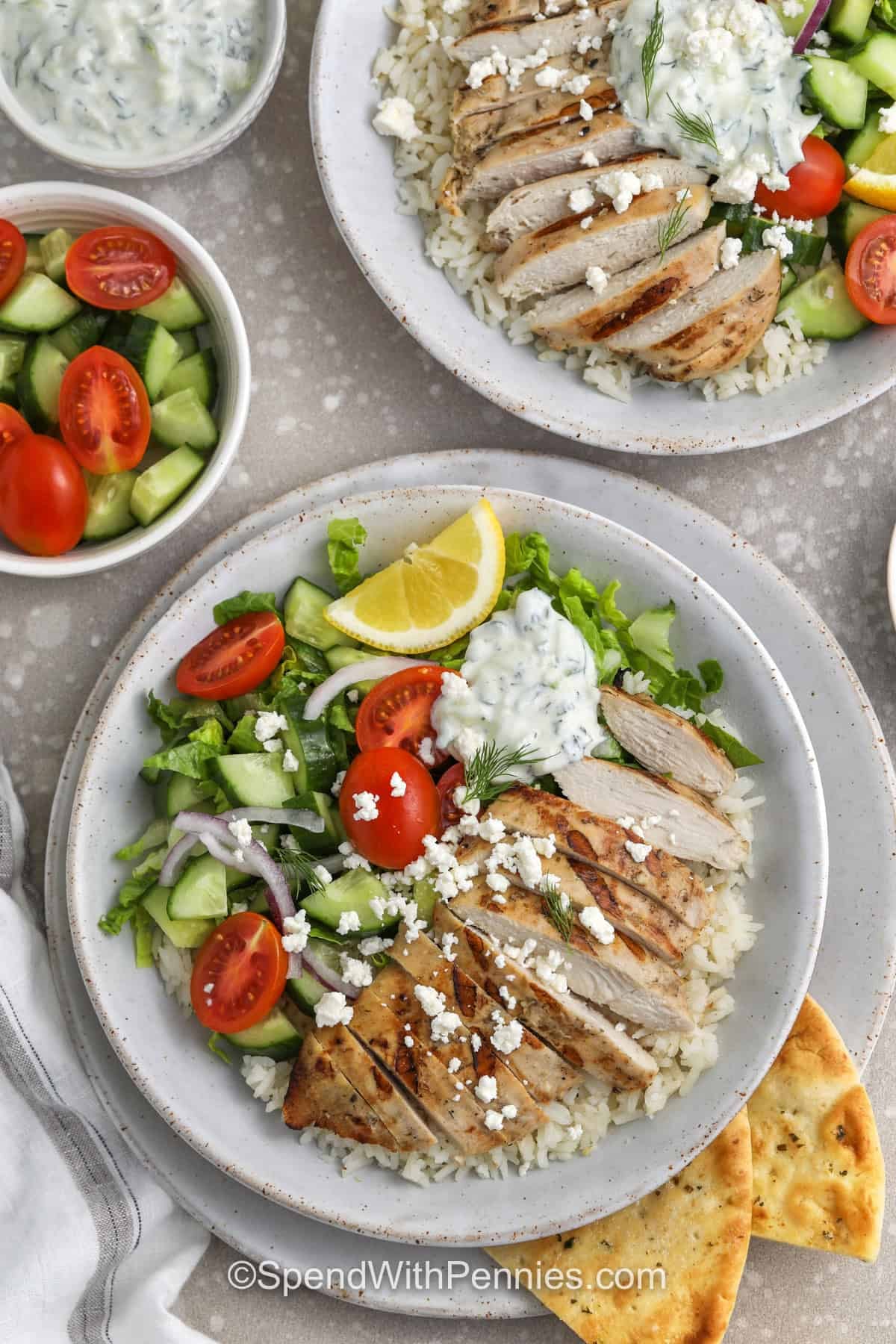 plated bowls of Greek Chicken Bowls