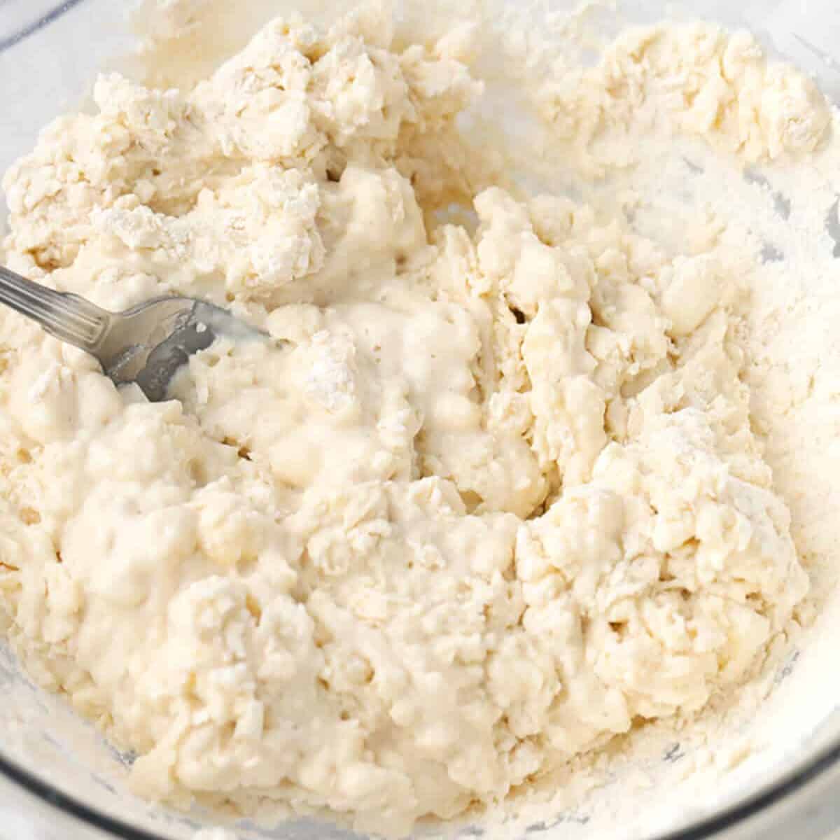 mixing wet and dry ingredients to make Homemade Biscuits