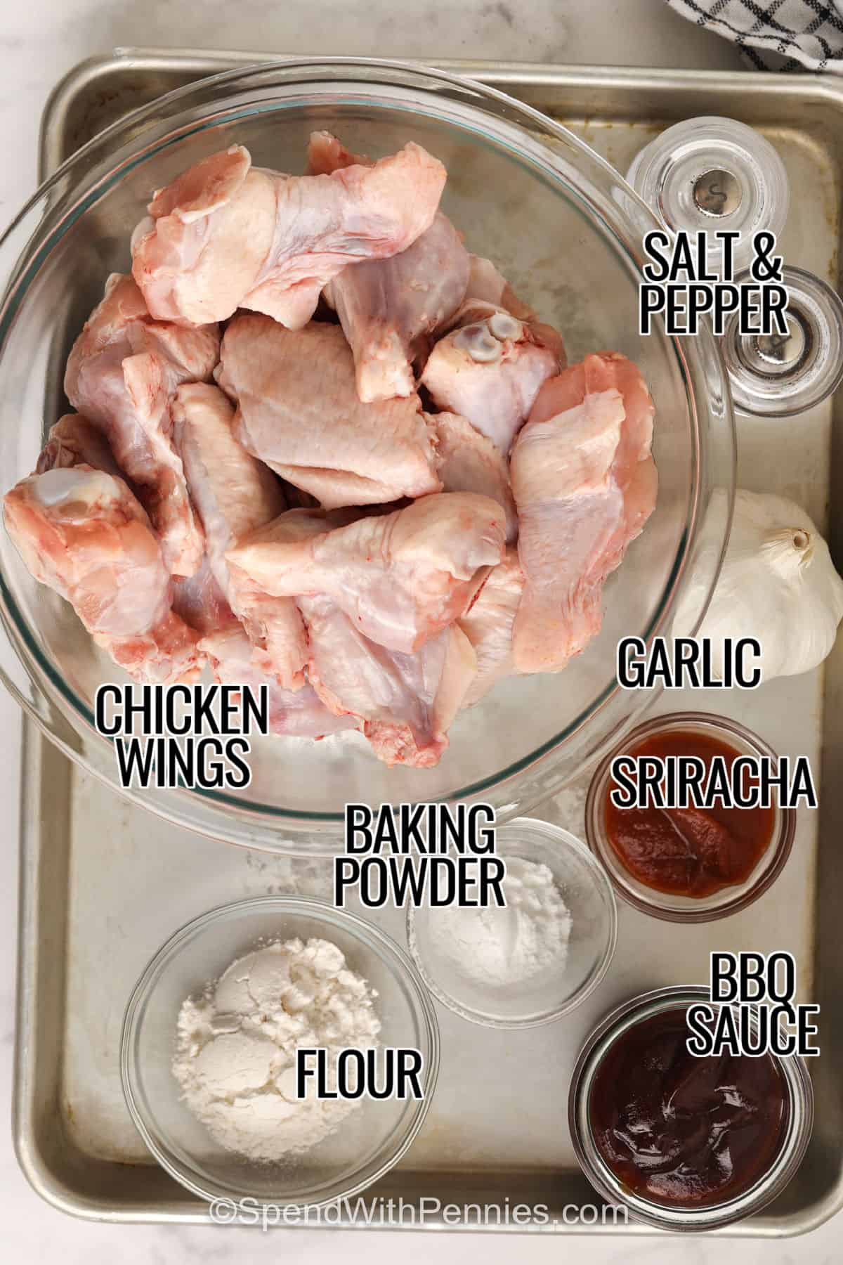 chicken wings , salt and pepper , garlic , sriracha , baking powder , flour , bbq sauce with labels to make BBQ Chicken Wings