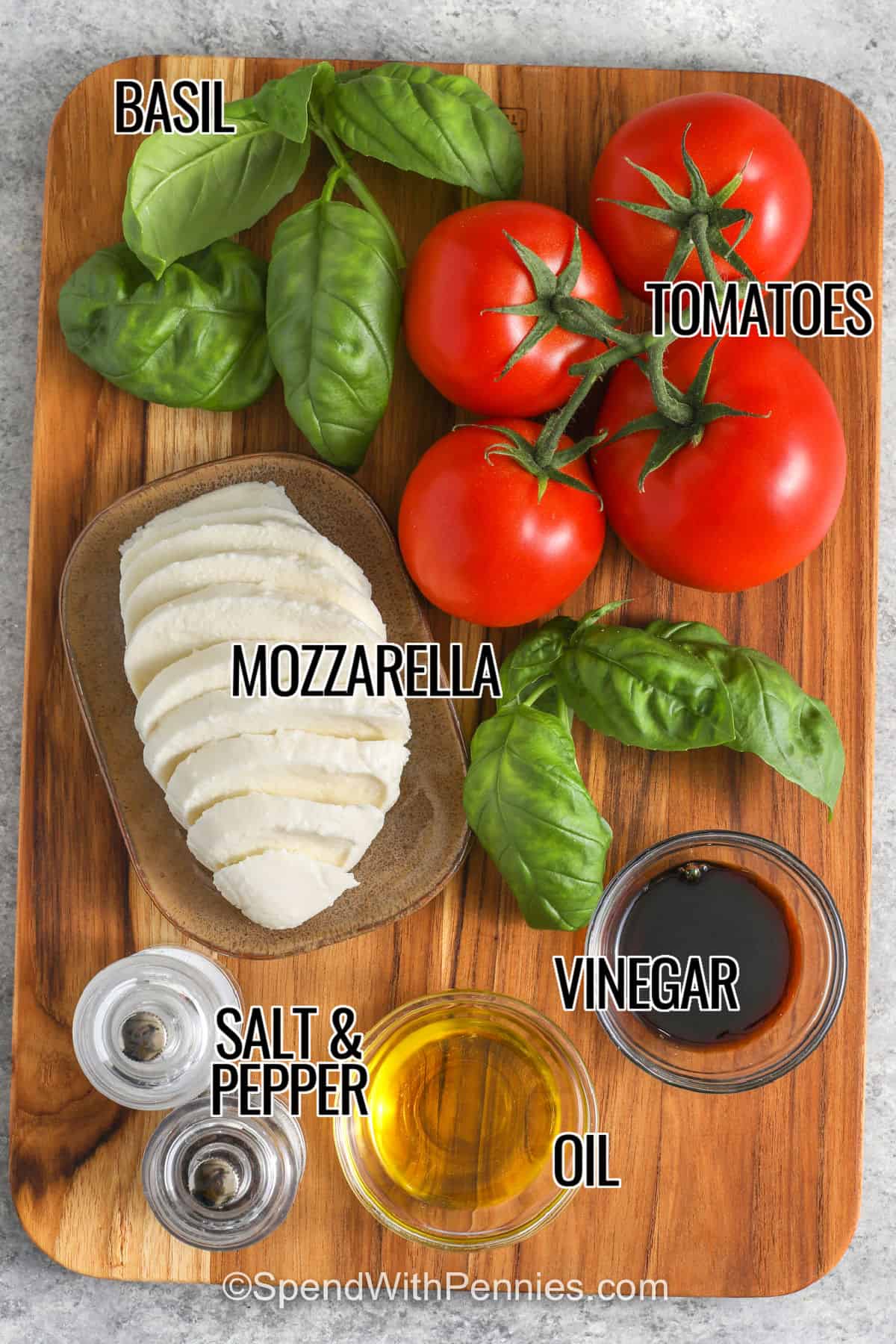 basil , tomatoes , mozzarella , vinegar , oil , salt and pepper with labels to make Caprese Salad