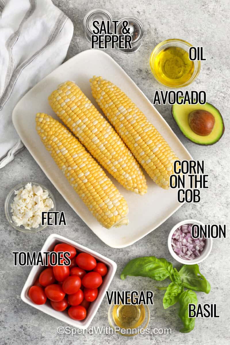 corn on the cob , avocado , oil , onion , basil , vinegar , tomatoes , feta, salt and pepper with labels to make Grilled Corn Salad