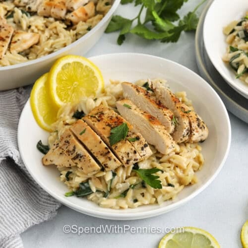 plated Lemon Chicken Orzo with pan full in the back