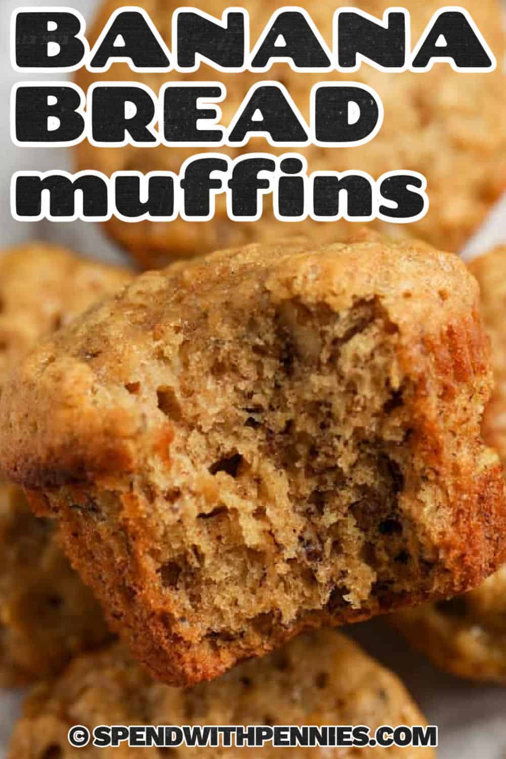 close up of fluffy Banana Bread Muffins with a bite taken out and a title