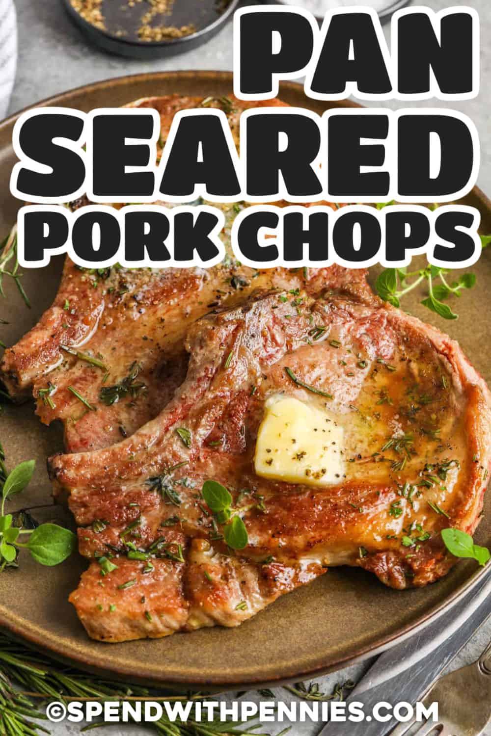These pan seared pork chops are all about crisp edges, tender meat, and buttery herb flavor. The pork chops are patted dry, seasoned with salt and pepper, then seared in a hot pan before being finished gently to keep them juicy. A quick rosemary and thyme butter brings everything together. Serve this easy pork chop dinner with potatoes, green beans, roasted carrots, or buttered noodles for a comforting meal. #spendwithpennies pan seared pork chops on a plate with butter