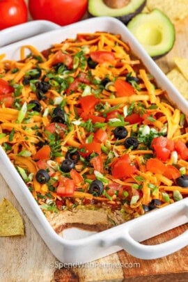 easy 7 Layer Dip in the casserole dish