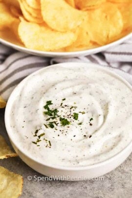 bowl of Sour Cream Dip with a bowl of chips in the background