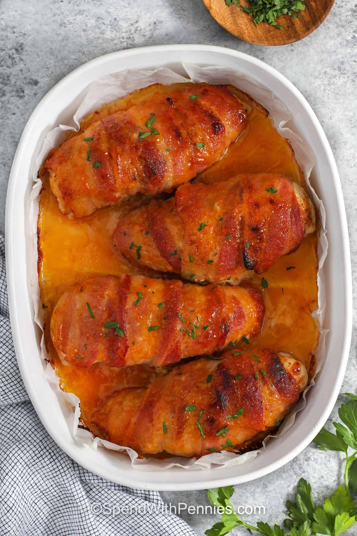 top view of cooked Bacon Wrapped Chicken in dish