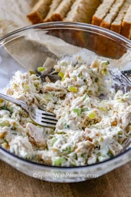 Classic Tuna Salad in a bowl with bread in the background