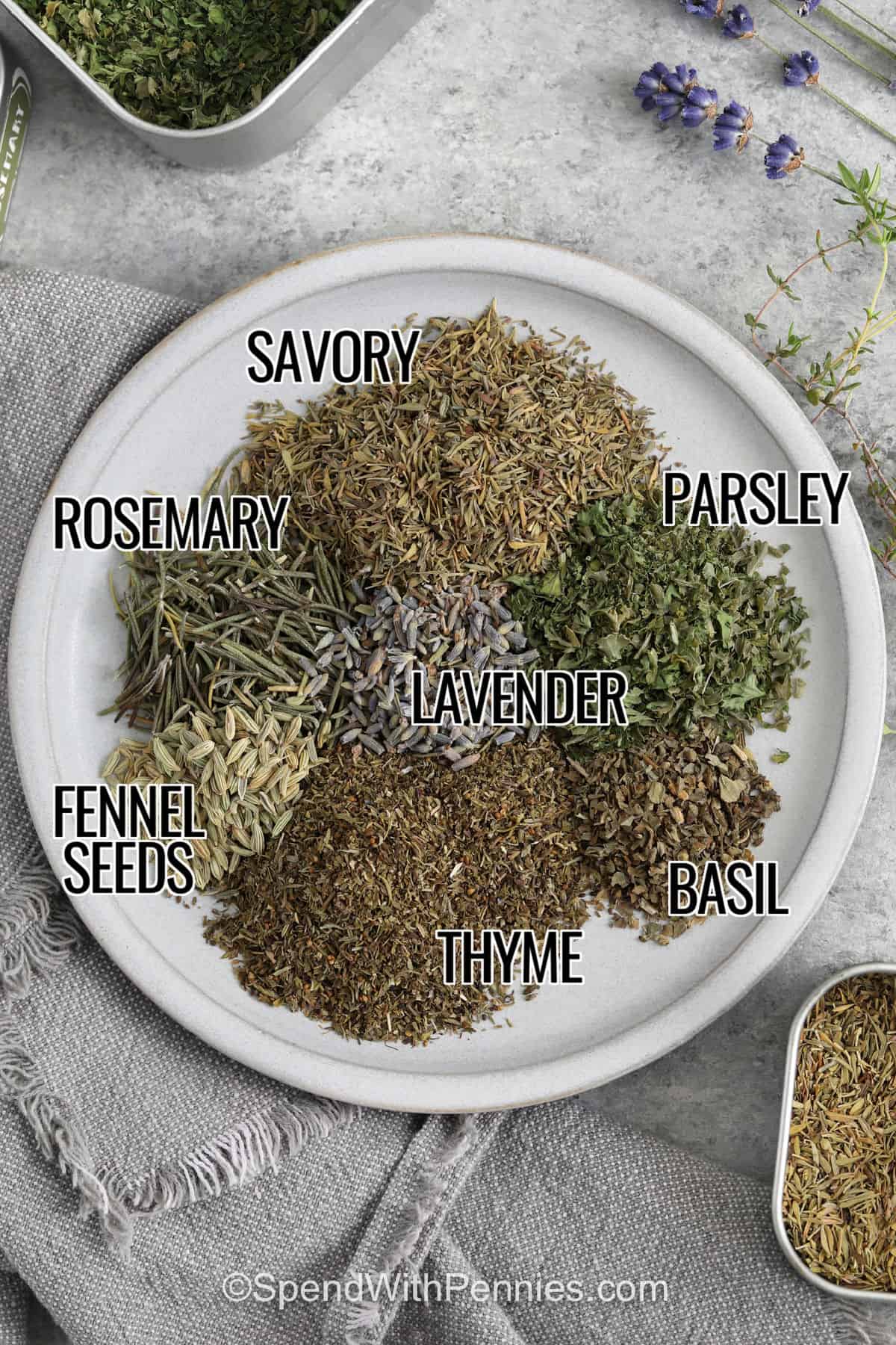 savory , parsley , lavender , rosemary, basil , thyme , fennel seeds with labels to make Herbes de Provence