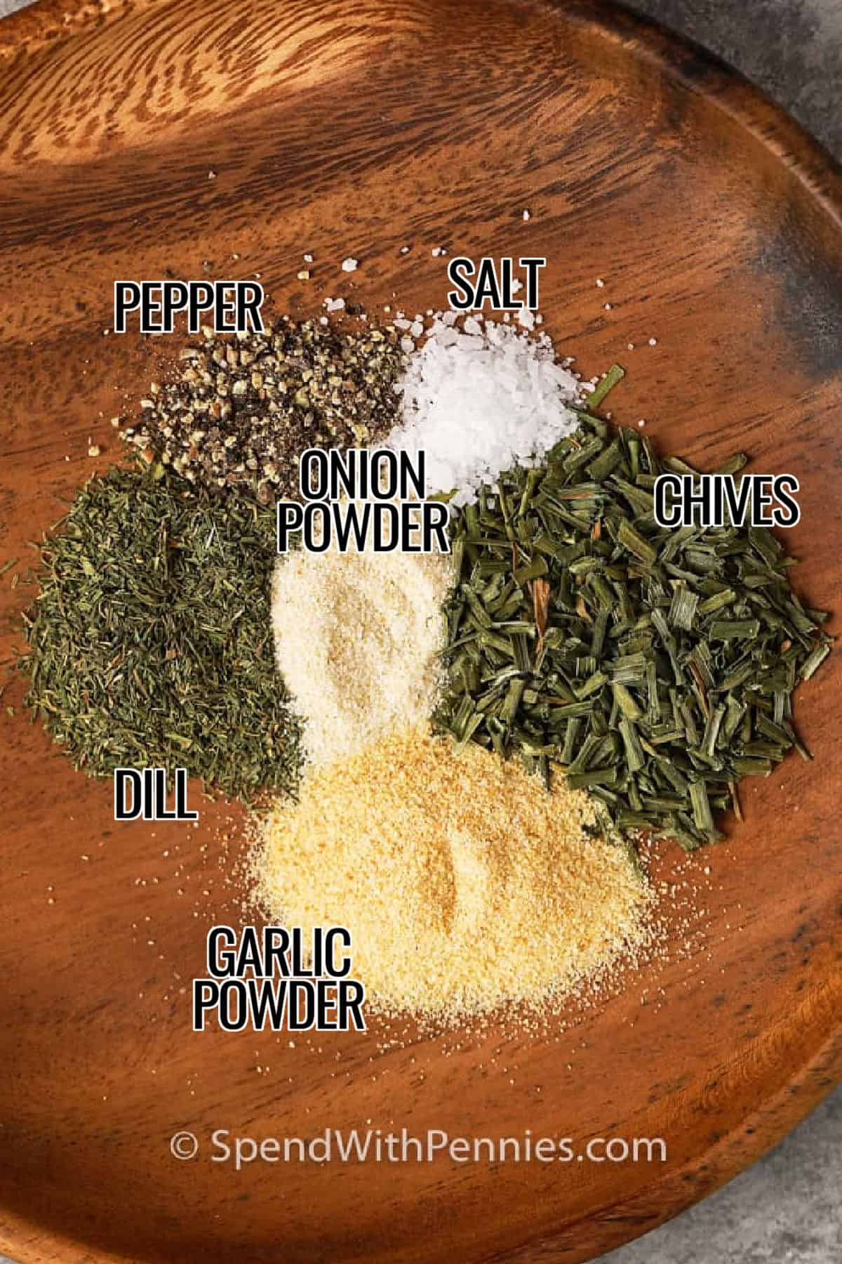 This easy sour cream dip is a simple make-ahead appetizer that works for parties, potlucks, and casual snack trays. The creamy base is made with sour cream and mayonnaise, then seasoned with dill, chives, garlic powder, and onion powder. Serve it cold with crunchy vegetables, chips, or crackers for a fresh-tasting dip that comes together with everyday ingredients. #spendwithpennies garlic powder , onion powder , dill , chives , salt and pepper with labels to make Sour Cream Dip
