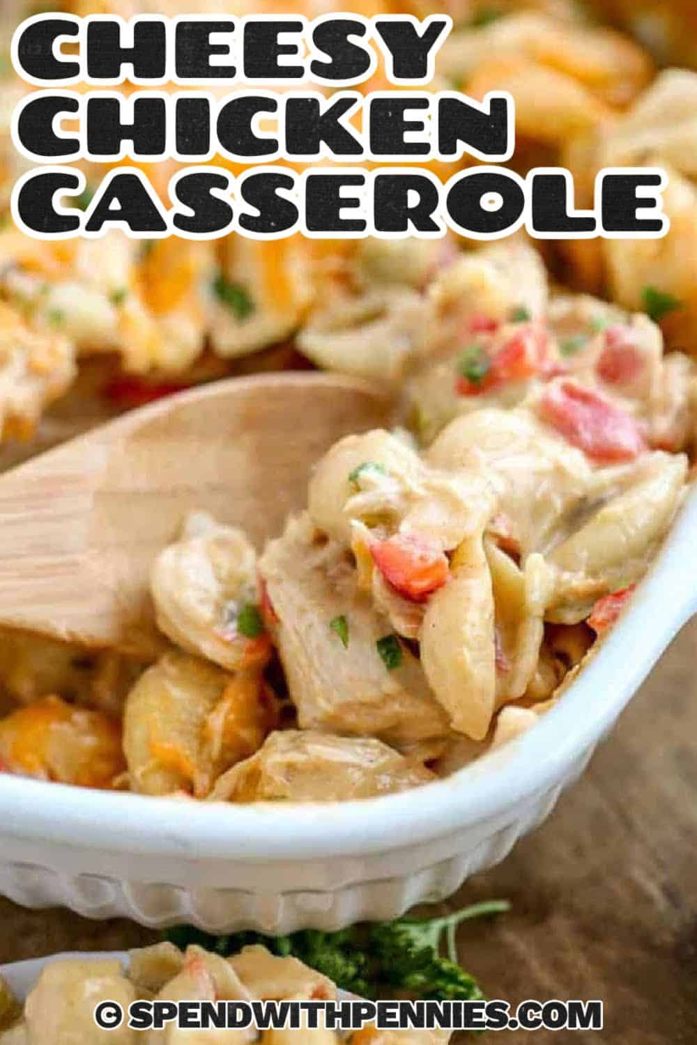 Cheesy Chicken Casserole in a casserole dish with wooden spoon and a title