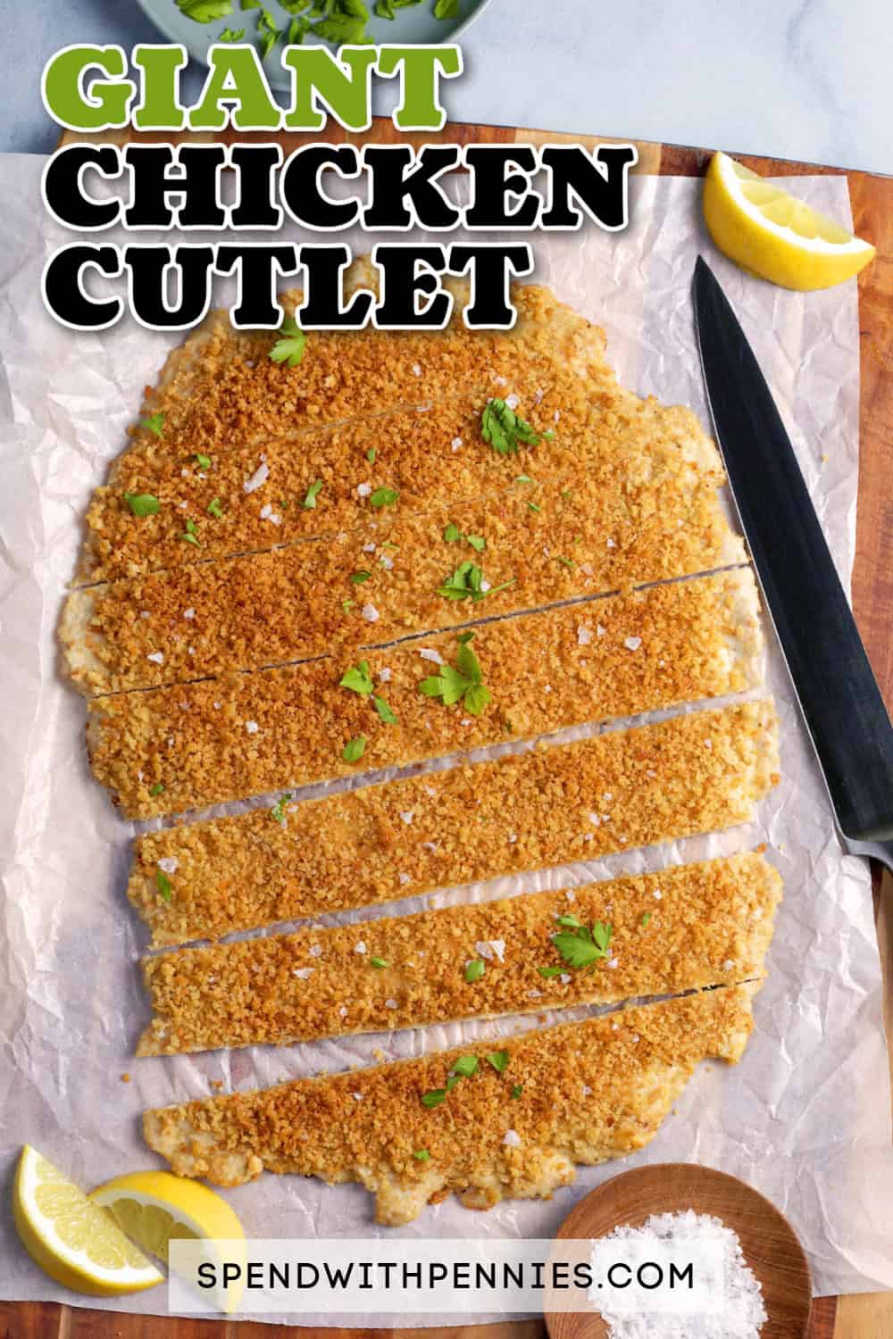 Sliced Giant Chicken Cutlet on a cutting board with a knife and a title.