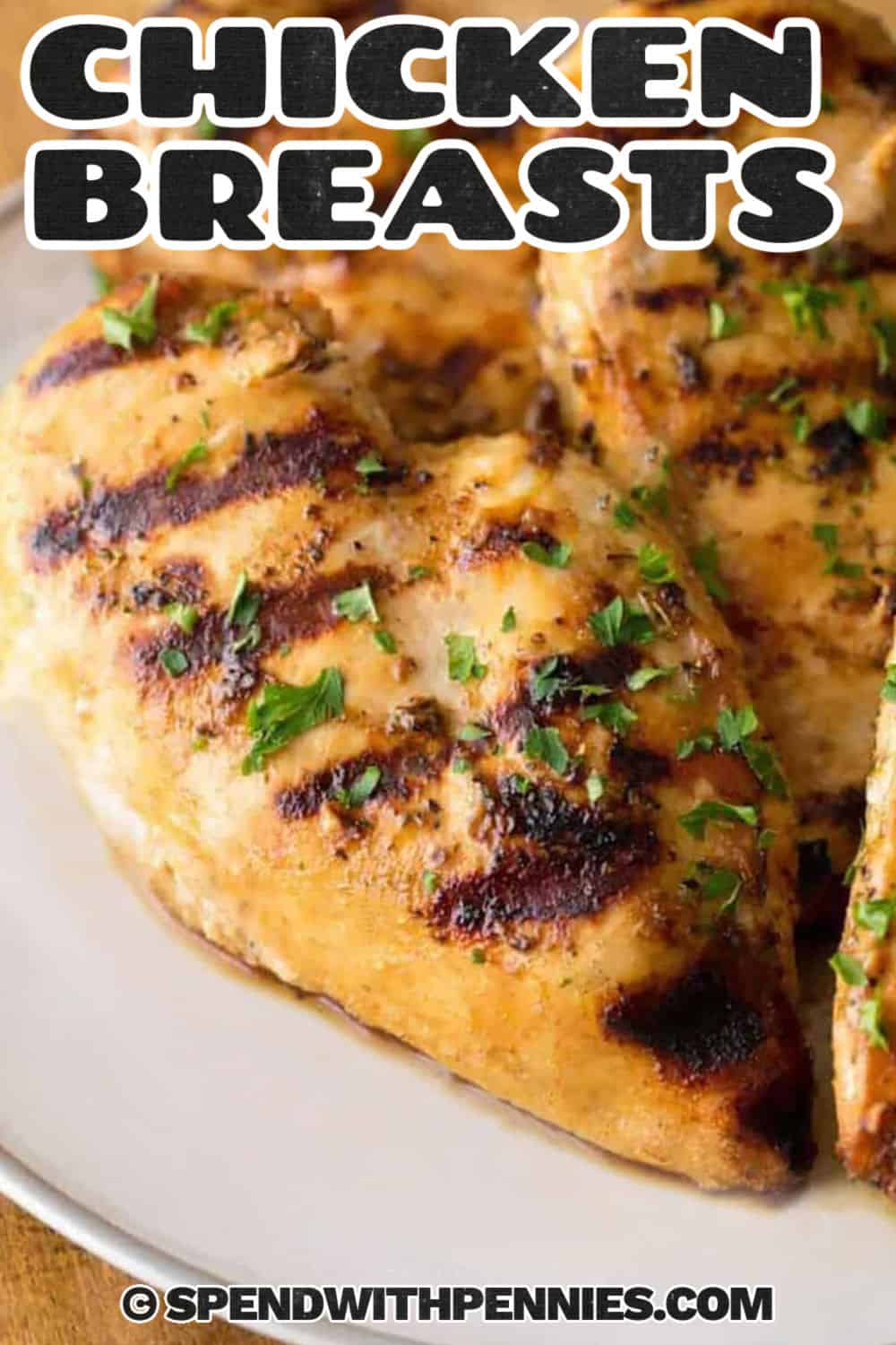 Grilled Chicken Breasts on a plate with a title