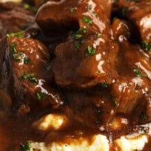 close up of Beef Tips on potatoes