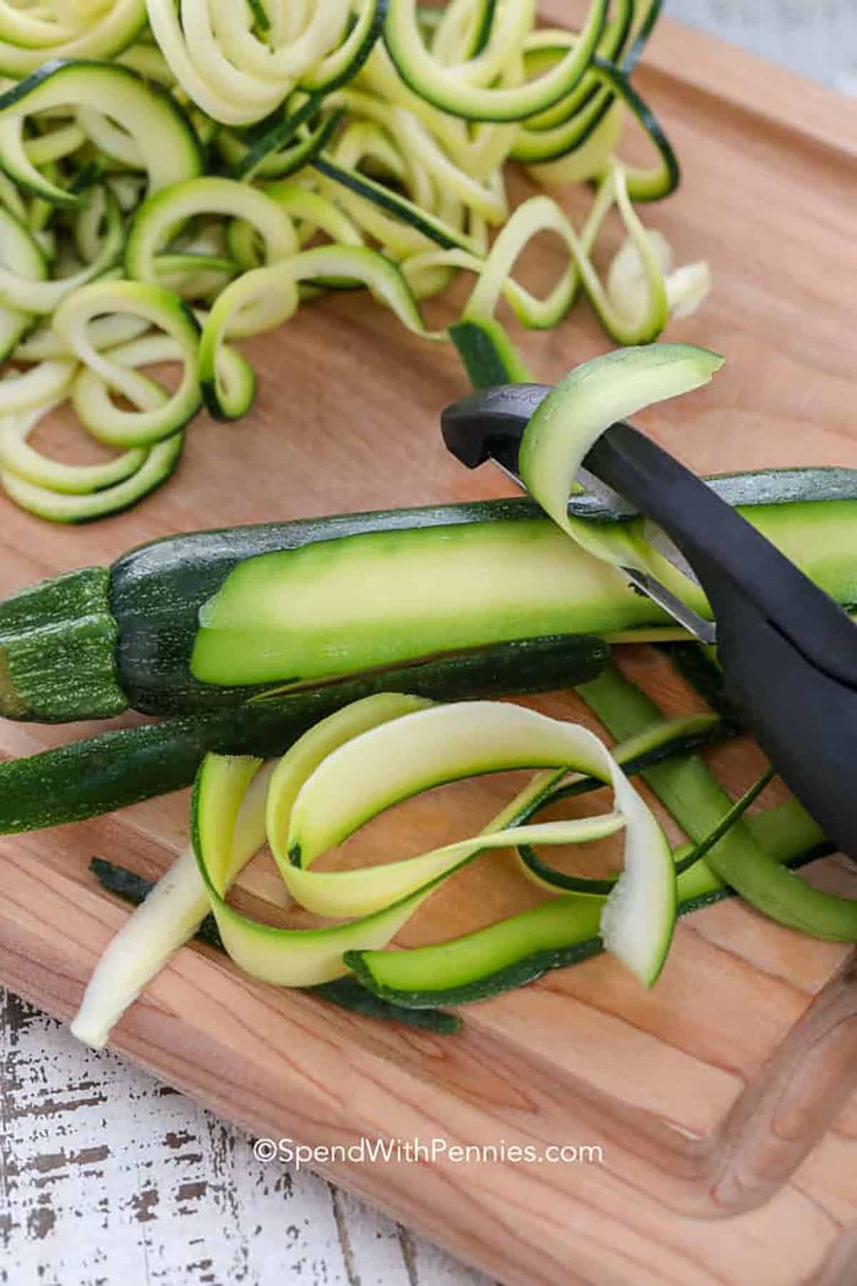 slicing zucchini to make Zucchini Noodles