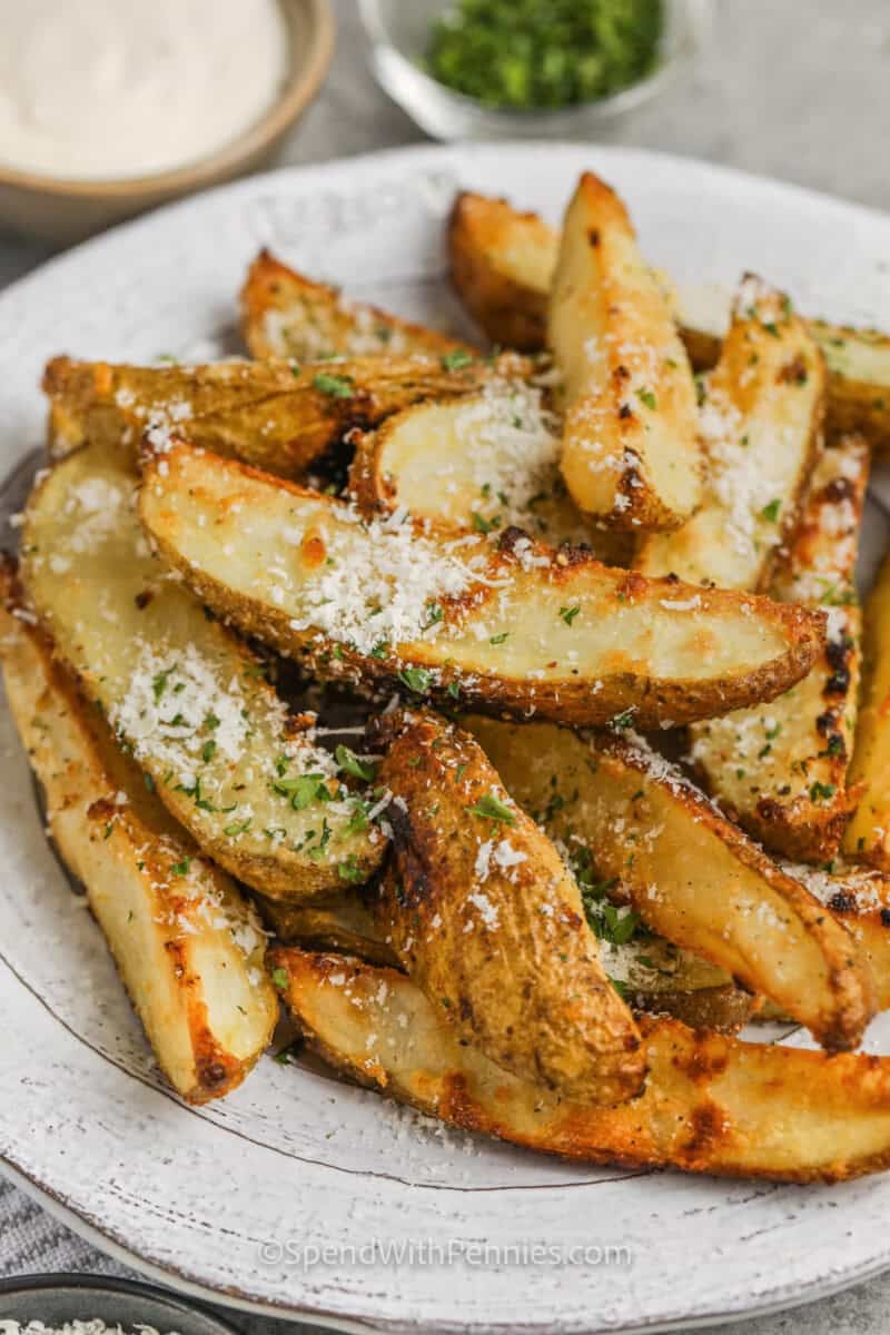 plated Crispy Baked Potato Wedges with parmesan and parsley