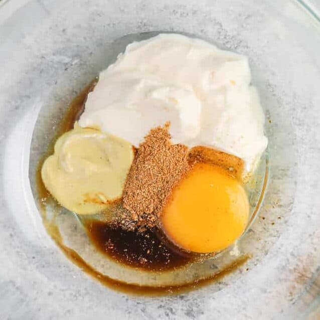 adding seasonings a dijon to mayonnaise and egg to make Easy Crab Cakes
