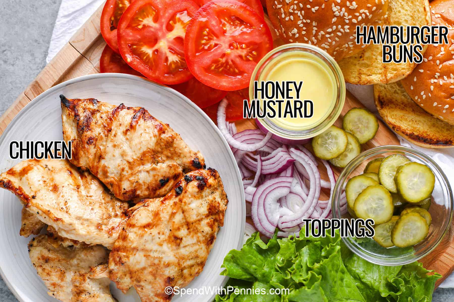 This grilled chicken burger has tender chicken, a golden toasted bun, and creamy honey mustard in every satisfying bite. The marinade adds sweetness and tang, while an instant-read thermometer makes it easy to cook the chicken safely without leaving it on the grill too long. Add crunchy pickles or fresh vegetables, then pair the sandwiches with potato salad, coleslaw, grilled corn, or fries for a complete warm-weather meal. #spendwithpennies labelled grilled chicken sandwich ingredients