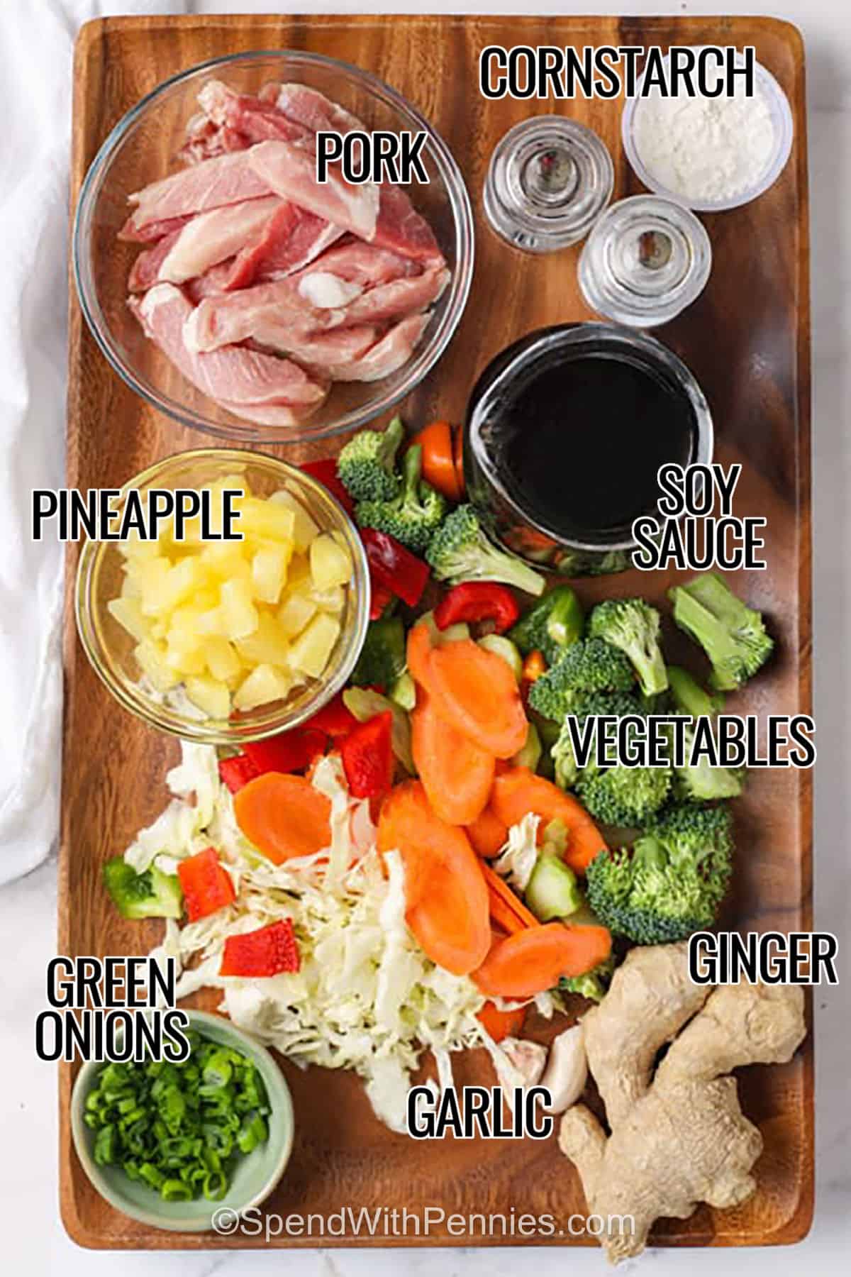 This pineapple pork stir fry is sweet, savory, and full of texture from juicy pork, colorful vegetables, and glossy homemade sauce. It is flexible enough for fresh or frozen vegetables and works well with pork chops or pork tenderloin. Serve this pork stir fry recipe over white rice, brown rice, lo mein noodles, or rice noodles for a cozy skillet dinner. #spendwithpennies pork , cornstarch , soy sauce , vegetables , ginger , garlic , pineapple , green onions to make Pork Stir Fry with labels