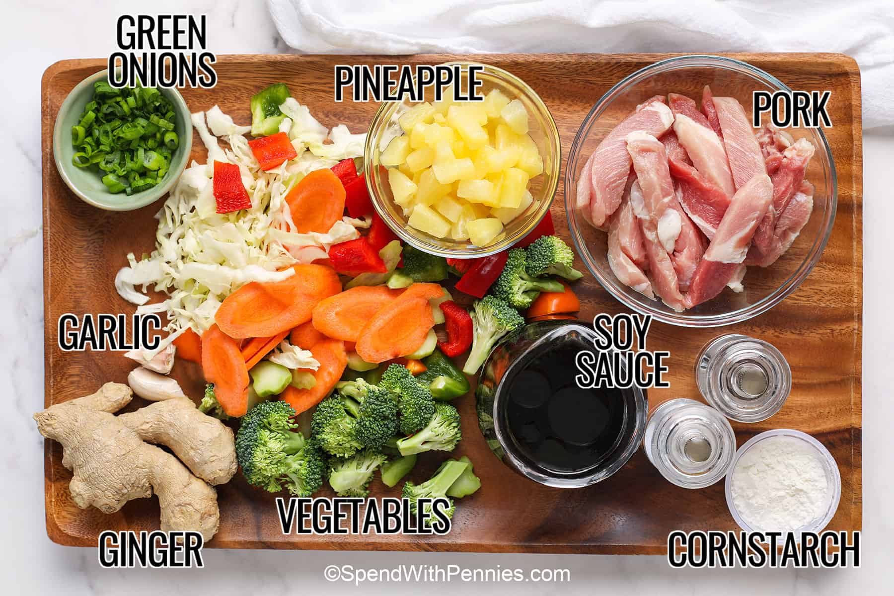 This pineapple pork stir fry is sweet, savory, and full of texture from juicy pork, colorful vegetables, and glossy homemade sauce. It is flexible enough for fresh or frozen vegetables and works well with pork chops or pork tenderloin. Serve this pork stir fry recipe over white rice, brown rice, lo mein noodles, or rice noodles for a cozy skillet dinner. #spendwithpennies