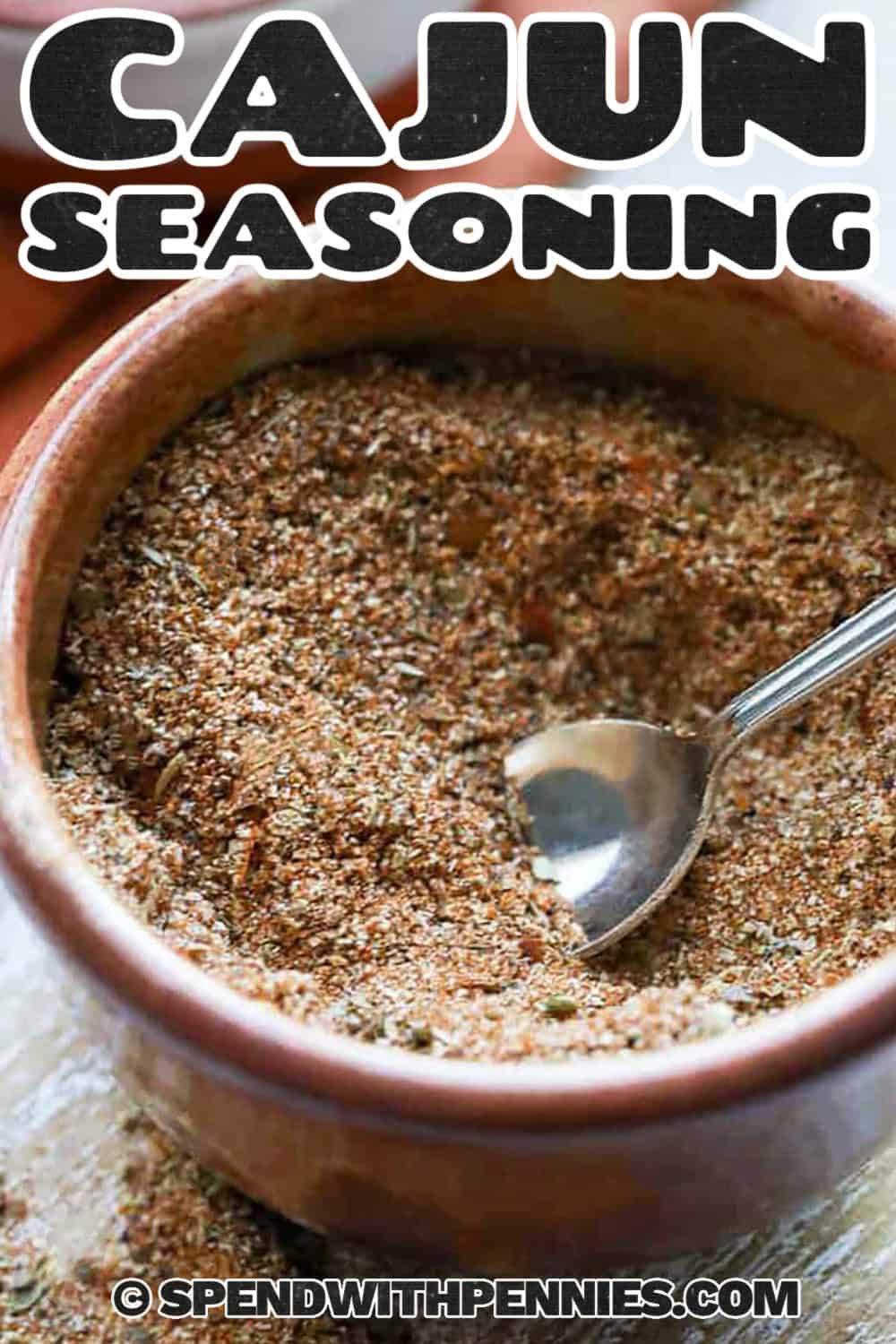 bowl of Cajun Seasoning with a spoon