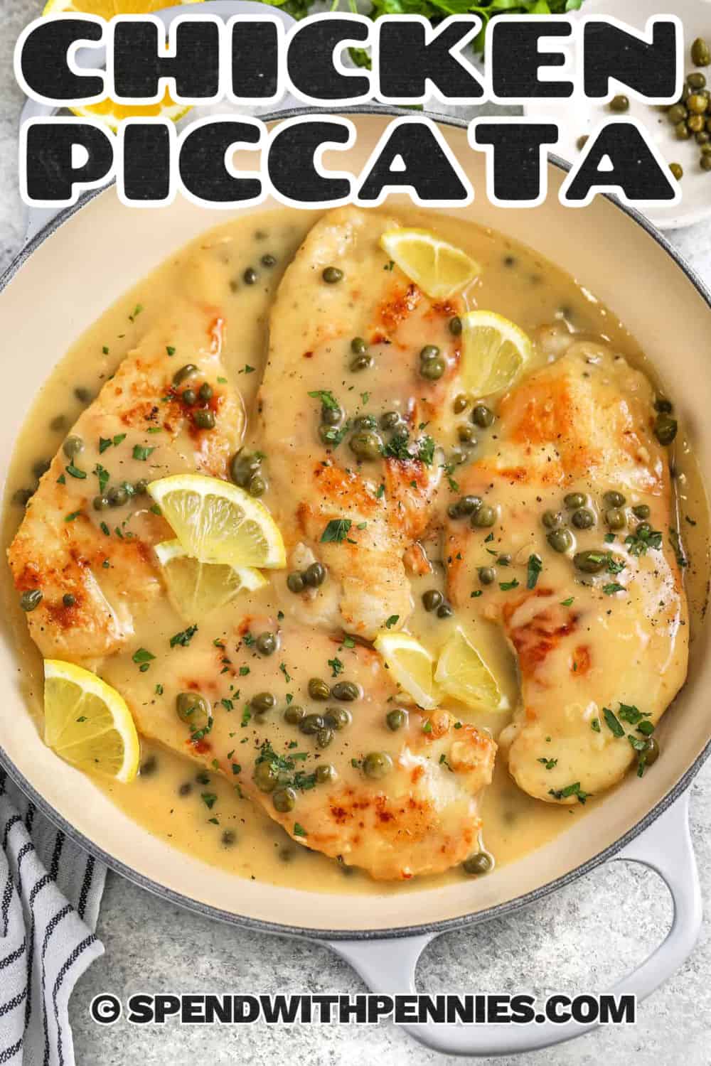 Lemon chicken piccata is an easy way to give everyday chicken breasts plenty of fresh, savory flavor. The chicken cooks quickly after being pounded thin, while the white wine and lemon pan sauce comes together in the same skillet. Butter softens the tangy lemon, capers add a salty contrast, and parsley provides a fresh finish. Pair it with linguine or roasted vegetables for a balanced weeknight dinner. Pin this recipe to your dinner board. #spendwithpennies chicken piccata in a skillet with writing