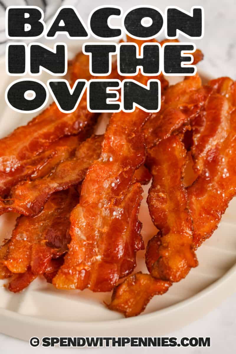 crispy bacon on a plate to show How to Cook Bacon in the Oven with a title