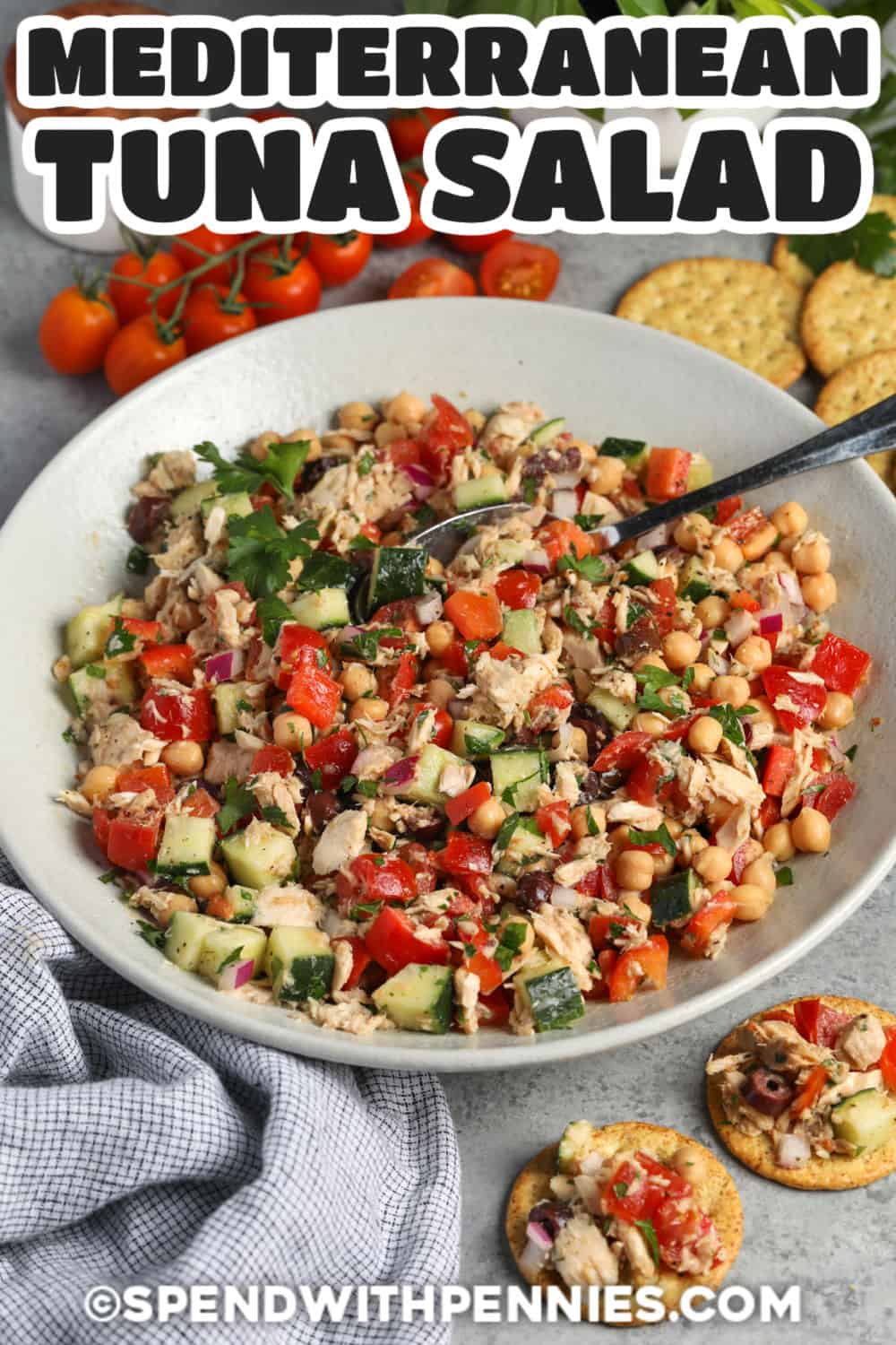 Make a healthy Mediterranean tuna salad without mayonnaise using chickpeas, crunchy vegetables, parsley, and briny Kalamata olives. Fresh lemon juice, red wine vinegar, garlic, and oregano create a bright Mediterranean-style dressing that coats every bite. This easy salad is hearty enough for lunch but still tastes light and refreshing. Save this salad for a quick meal that uses simple pantry ingredients. #spendwithpennies ingredients to make Mediterranean Tuna Salad with a title