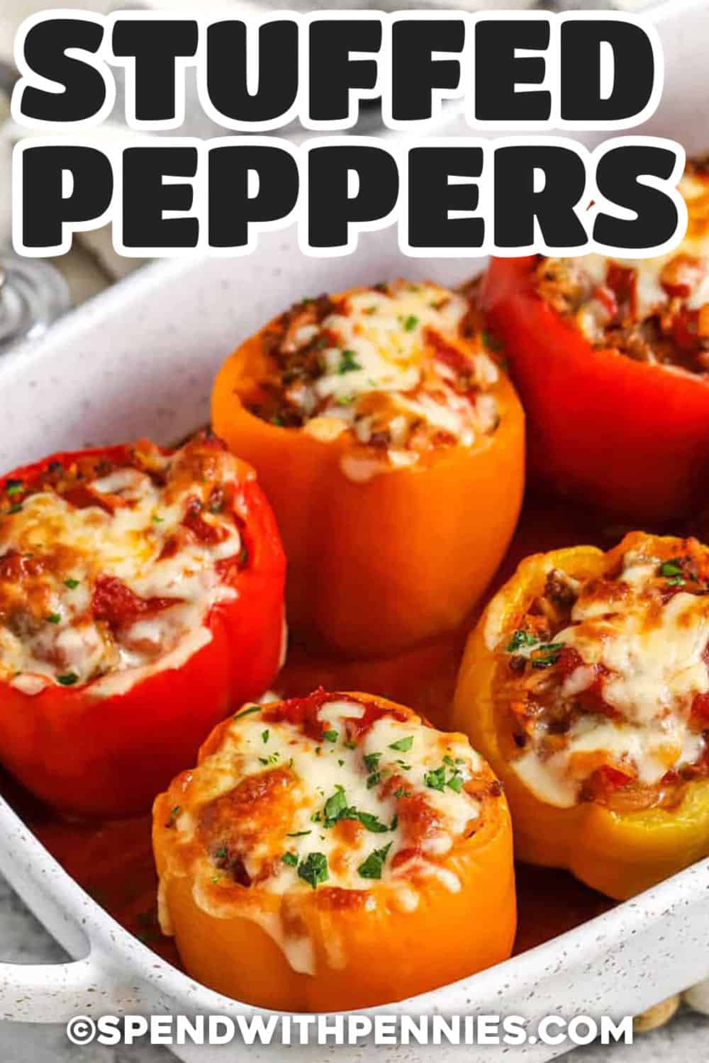 Classic stuffed peppers are a practical family dinner with simple ingredients and big flavor. Bell peppers are filled with ground beef, Italian sausage, long grain rice, diced tomatoes, and marinara sauce, then baked until the peppers are tender. This recipe is great for meal prep because leftovers reheat well and the peppers can be assembled ahead for the freezer. Pin these stuffed peppers to your dinner board. #spendwithpennies cheesy Stuffed Peppers with a title