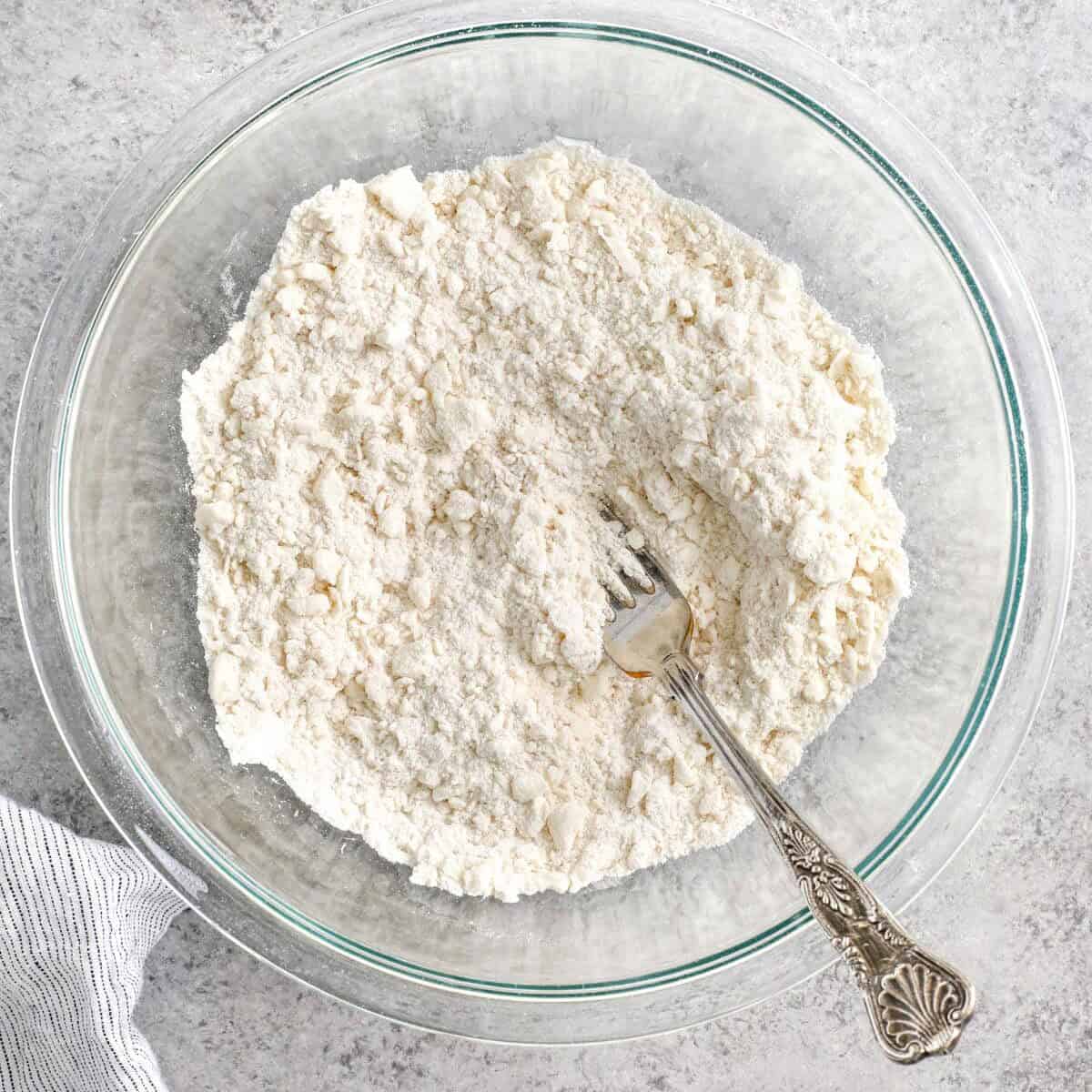 adding butter to flour to make dough for dumplings for Old Fashioned Chicken and Dumplings