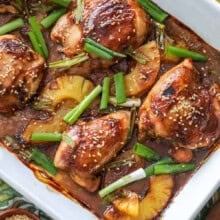 Pineapple Teriyaki Chicken in the dish with pineapple rings and green onions