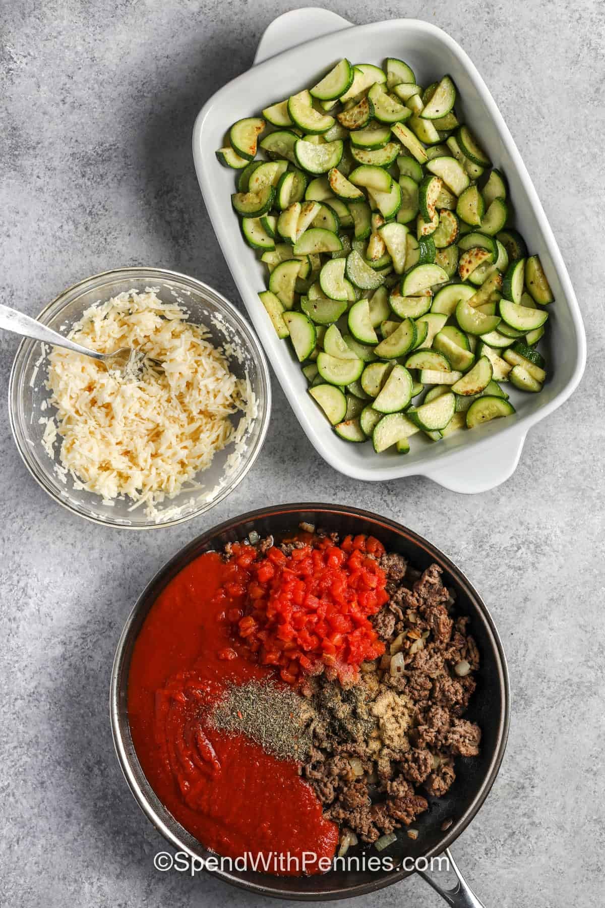 adding ingredients to pan to make Zucchini Hamburger Casserole