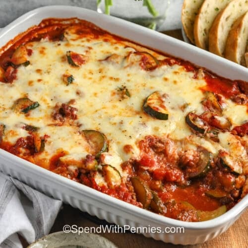 casserole dish of Zucchini Hamburger Casserole with garlic toast