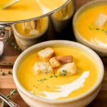 bowls of Butternut Squash Soup with pot full in the back.