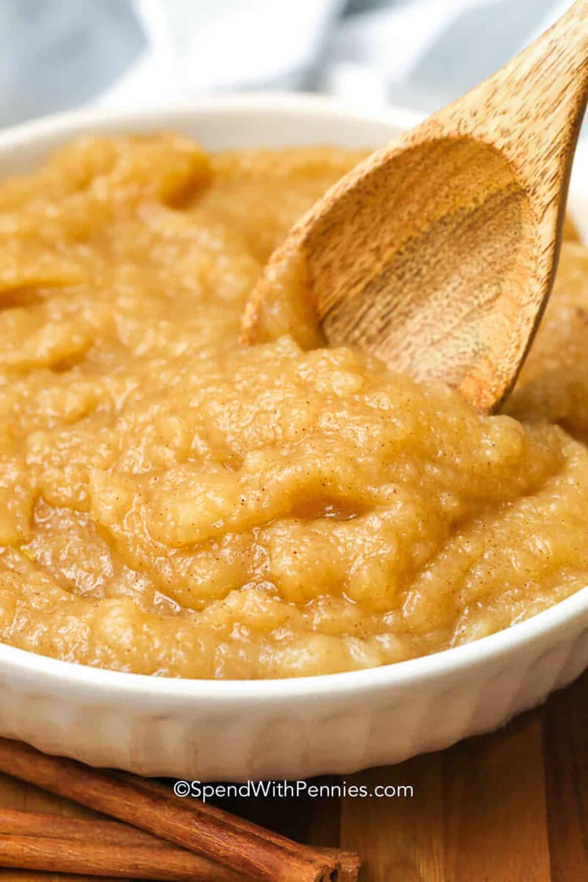 bowl of Homemade Applesauce Recipe with a wooden spoon