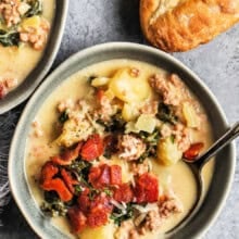 bowls of Zuppa Toscana with bread.