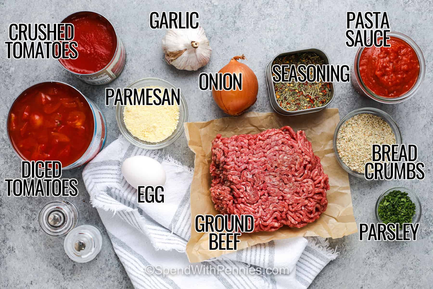 These crockpot meatballs turn ground beef, Parmesan, breadcrumbs, parsley, and Italian seasoning into a cozy dinner with only a few minutes of hands-on prep. The homemade meatballs cook directly in a rich tomato and marinara sauce, so there is no browning and no extra skillet to wash. Spoon the tender meatballs over spaghetti with extra Parmesan for an easy family meal. Save this meatballs recipe for your next pasta night. #spendwithpennies crushed tomatoes , diced tomatoes , parmesan , garlic , onion , egg , ground beef , onion , seasoning , pasta sauce , bread crumbs , parsley with labels to make Crockpot Meatballs