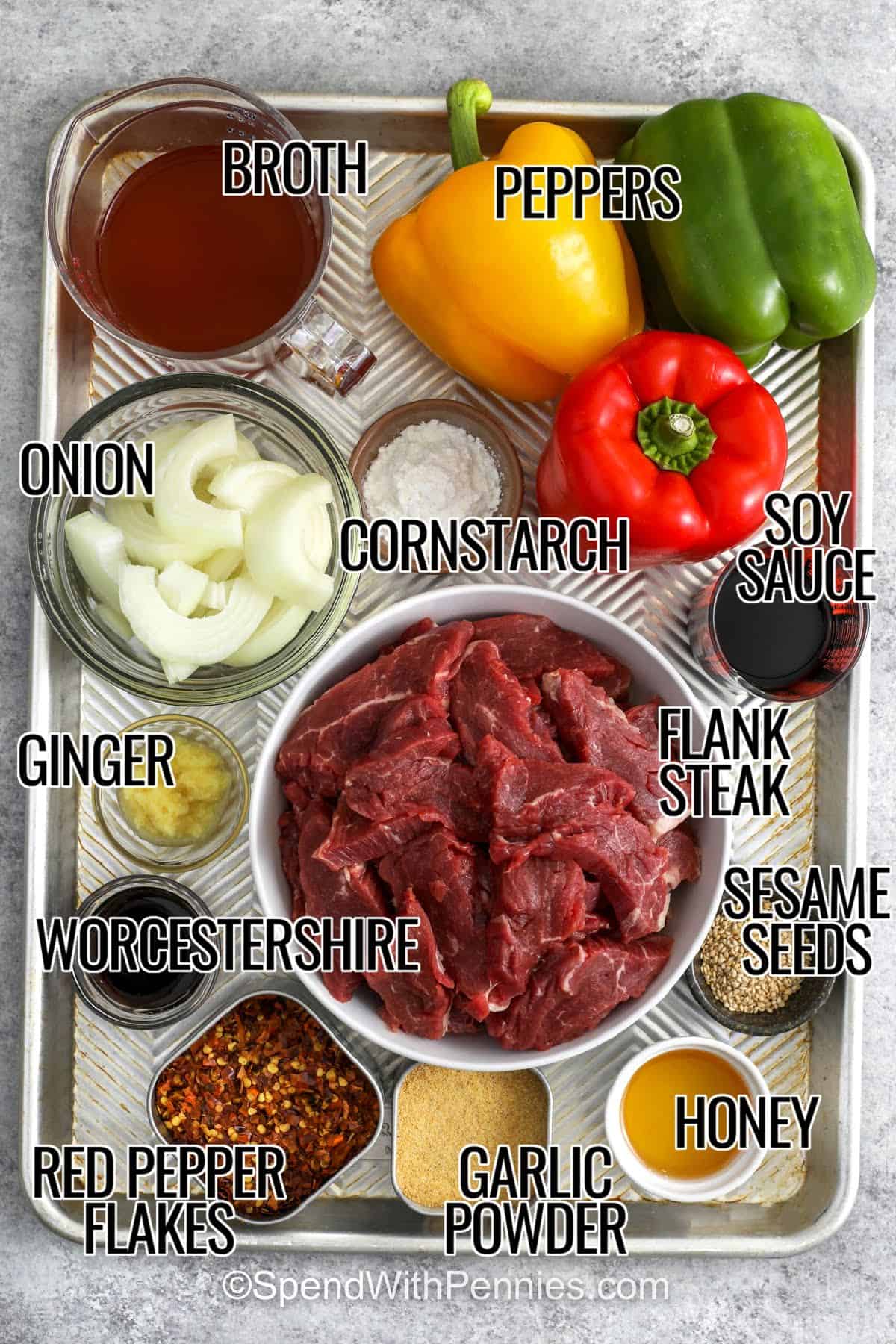 For an easy dinner, slow cooker pepper steak is a delicious choice filled with tender beef and colorful vegetables. The flavorful sauce blends soy sauce, ginger, honey, Worcestershire sauce, and garlic into a tasty coating for every bite. Serve it over steamed rice or noodles to soak up the extra sauce. Green onions and sesame seeds add a fresh finishing touch. Make this simple slow cooker beef recipe part of your next family dinner. #spendwithpennies broth , peppers , onion , cornstarch , soy sauce , flank steak , ginger , Worcestershire , red pepper flakes , garlic powder , honey , sesame seeds with labels to make Slow Cooker Pepper Steak