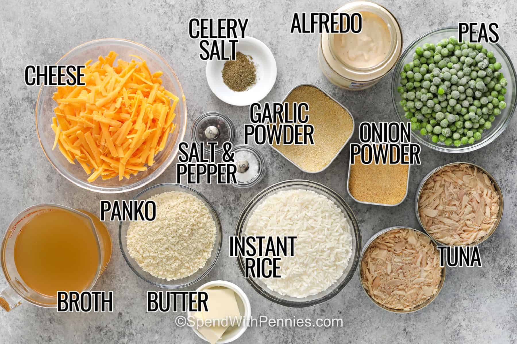 Easy tuna rice casserole turns simple pantry and freezer staples into a cozy family dinner. Uncooked instant rice bakes in creamy Alfredo sauce and broth along with tuna, peas, seasonings, and sharp cheddar cheese. The casserole finishes uncovered with buttery Panko and more cheddar for a crisp contrast to the creamy rice underneath. Keep this simple casserole handy for busy evenings and save the recipe to try soon. #spendwithpennies cheese , Panko , broth , butter , instant rice , tuna , onion powder , garlic powder , peas , alfredo , celery salt , salt and pepper with labels to make Tuna Rice Casserole.