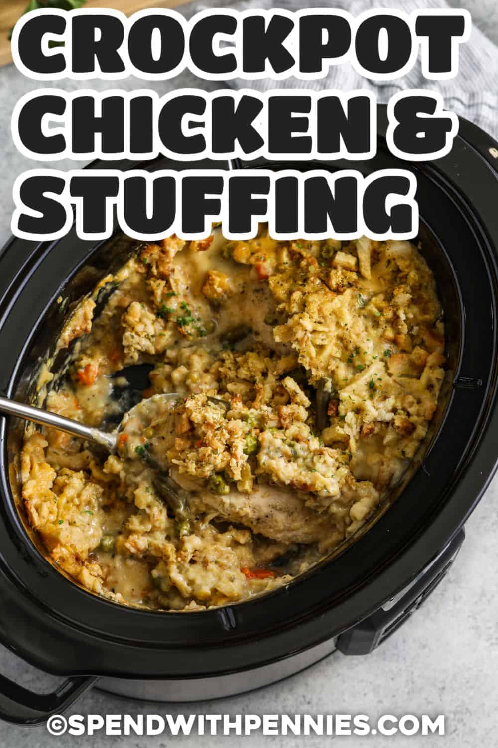 Crockpot chicken and stuffing brings the cozy flavors of a Sunday chicken dinner to the table with only minutes of hands-on prep. Chicken breasts, herb-seasoned stuffing, frozen vegetables, cream of chicken soup, and broth cook together into a creamy, hearty meal. Use mixed vegetables or green beans and adjust the broth for softer or firmer stuffing. Save this comforting slow cooker recipe for a chilly evening. #spendwithpennies Crockpot Chicken and Stuffing in the pot with writing