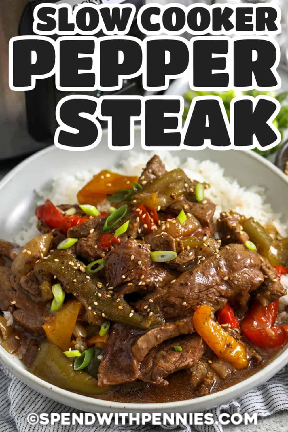 Slow cooker pepper steak turns simple ingredients into a flavorful dinner everyone can enjoy. Tender strips of beef cook with bell peppers and onions in a savory sauce made with soy sauce, ginger, honey, and Worcestershire sauce. Red pepper flakes add a little heat, while rice or noodles make it a filling meal. This easy beef recipe is perfect for busy weeknights when you want something comforting. Save this recipe and make it soon. #spendwithpennies Slow Cooker Pepper Steak on rice with a title