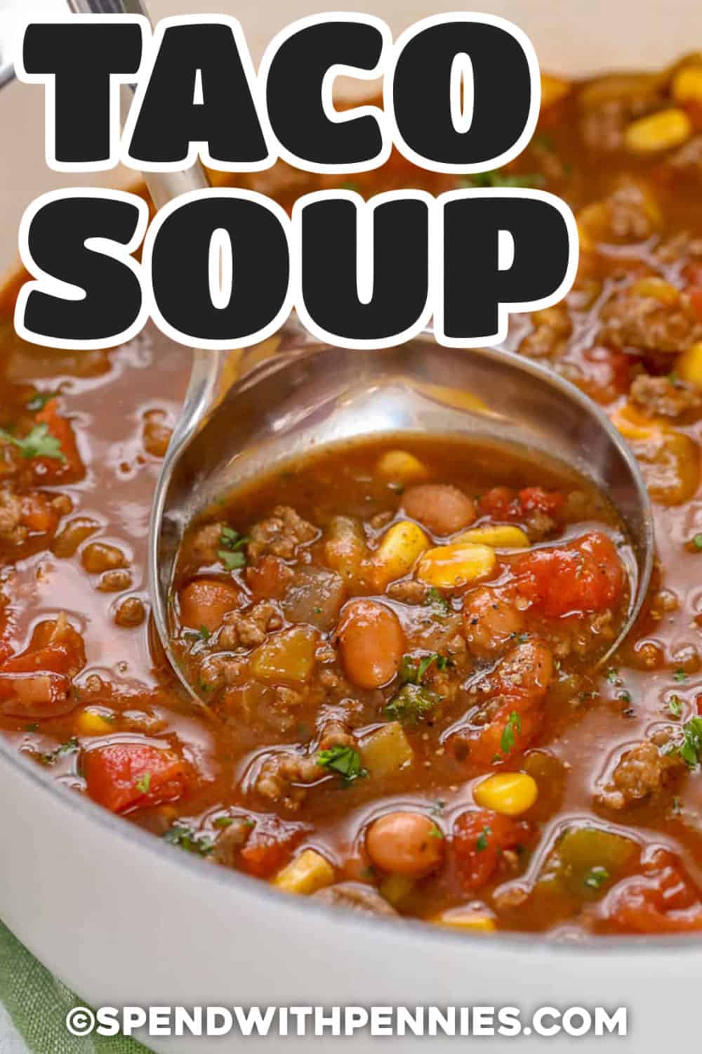 taking Taco Soup Recipe out of the pot with a ladle and a title