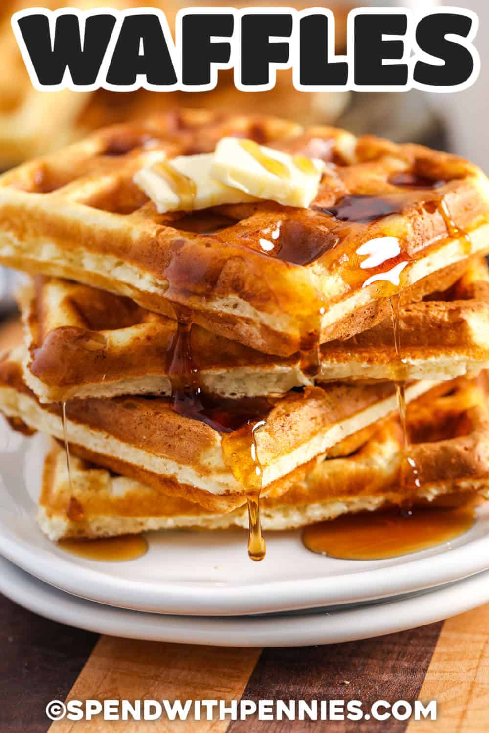 A properly heated waffle maker is the secret to the crisp exterior in this waffle recipe. Inside, the waffles remain light, buttery, and tender thanks to milk, melted butter, and gently folded egg whites. Keep each batch warm in a low oven, then serve everything together with syrup and fruit. This method works with many classic or Belgian-style waffle makers. Pin the recipe for your next brunch menu. #spendwithpennies Waffle Recipe with syrup and butter with writing