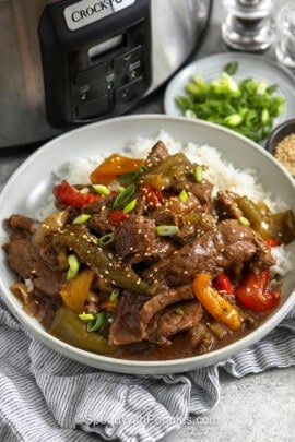plate of Slow Cooker Pepper Steak on rice.