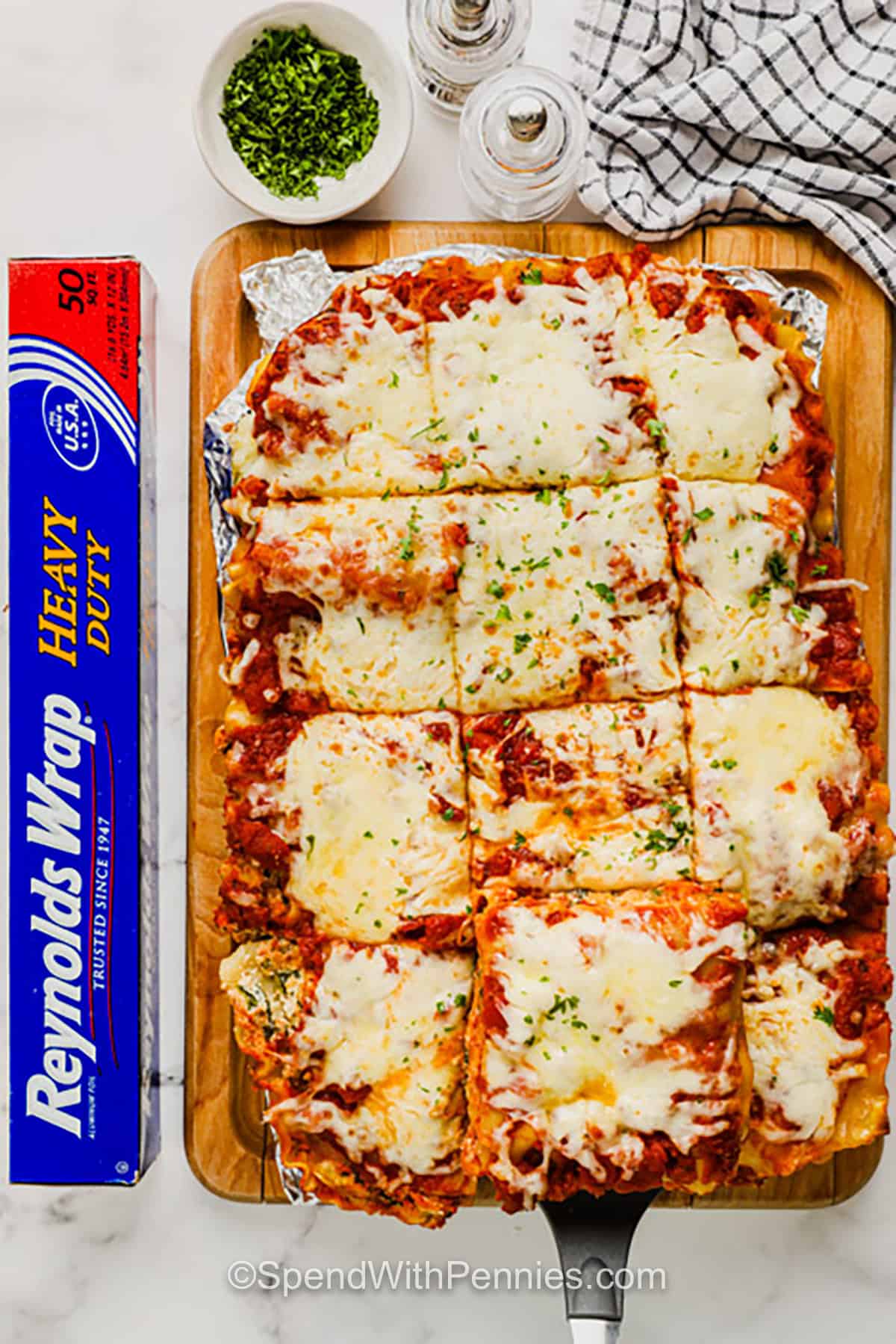 spinach lasagna on a cutting board.